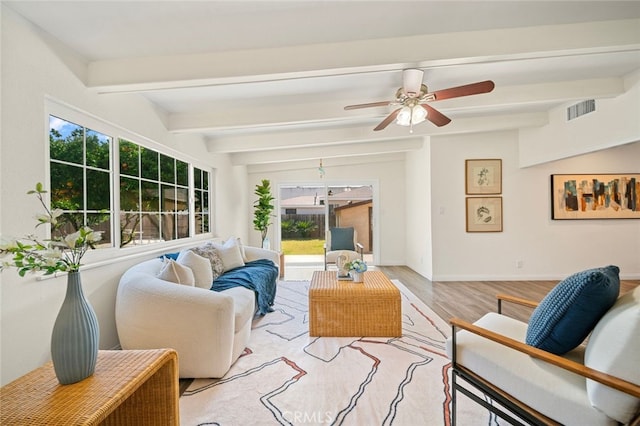 12218 Academy Way, Artesia, CA 90701 - living area featuring light wood-style floors, beamed ceiling, and ceiling fan