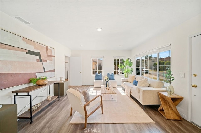 12218 Academy Way, Artesia, CA 90701 - living room featuring wood finished floors and recessed lighting