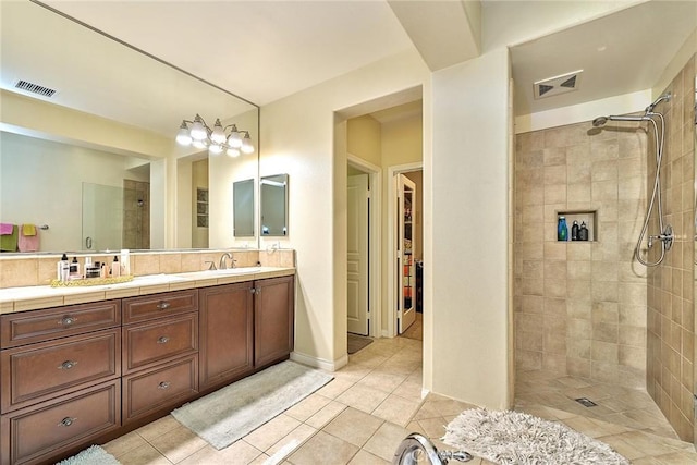 18977 Phelham Way, Yorba Linda, CA 92886 - full bathroom with tiled shower, tile patterned floors, double vanity, and a walk in closet