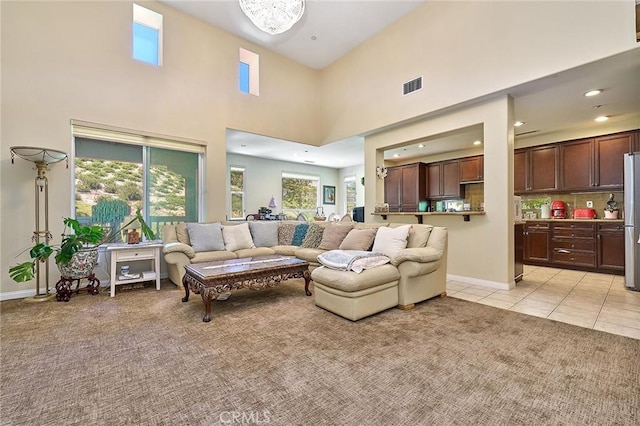 18977 Phelham Way, Yorba Linda, CA 92886 - living area with light colored carpet, a towering ceiling, recessed lighting, and light tile patterned flooring