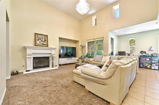 18977 Phelham Way, Yorba Linda, CA 92886 - living area featuring a towering ceiling, a glass covered fireplace, and light carpet
