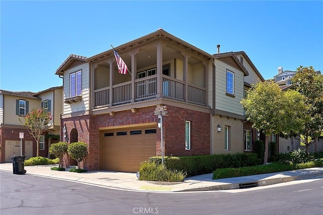 18977 Phelham Way, Yorba Linda, CA 92886 - view of front of property with a balcony, a garage, brick siding, and concrete driveway