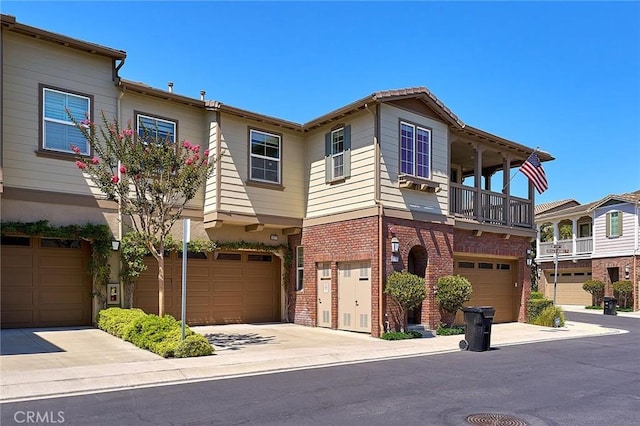 18977 Phelham Way, Yorba Linda, CA 92886 - view of front facade with a garage, brick siding, a balcony, and driveway