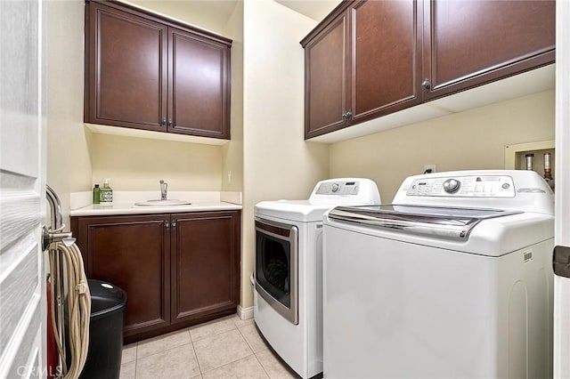 18977 Phelham Way, Yorba Linda, CA 92886 - washroom featuring separate washer and dryer, cabinet space, and light tile patterned floors