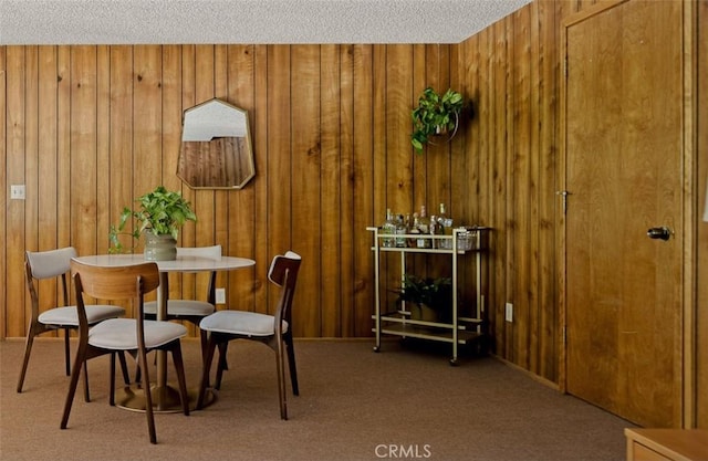 28645 Shenandoah Dr, Lake Arrowhead, CA 92352 - dining room with carpet, wood walls, and a textured ceiling