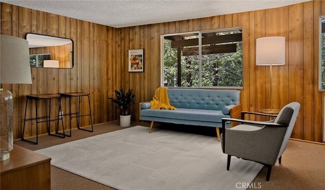 28645 Shenandoah Dr, Lake Arrowhead, CA 92352 - living area with carpet flooring, wood walls, and a textured ceiling