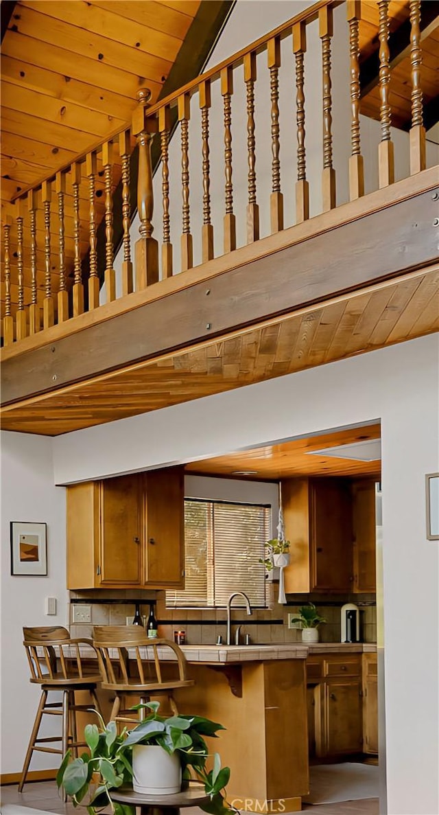 28645 Shenandoah Dr, Lake Arrowhead, CA 92352 - kitchen with wooden ceiling, vaulted ceiling, and backsplash