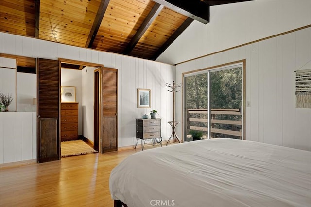 28645 Shenandoah Dr, Lake Arrowhead, CA 92352 - bedroom with light wood-style flooring, wooden walls, wooden ceiling, and access to exterior