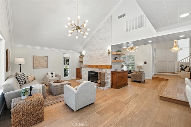 24901 Del Monte St, Laguna Hills, CA 92653 - living room with light wood finished floors, a chandelier, high vaulted ceiling, a fireplace, and ornamental molding
