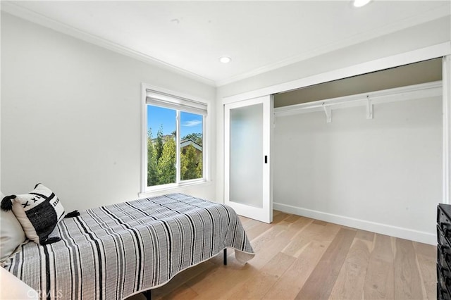 24901 Del Monte St, Laguna Hills, CA 92653 - bedroom with light wood finished floors, crown molding, recessed lighting, and a closet