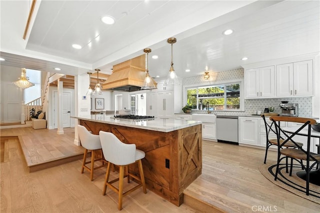 24901 Del Monte St, Laguna Hills, CA 92653 - kitchen with stainless steel appliances, light wood finished floors, custom range hood, white cabinetry, and recessed lighting