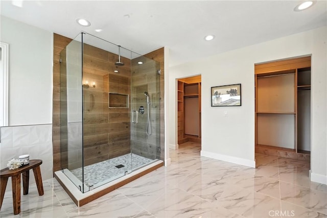 24901 Del Monte St, Laguna Hills, CA 92653 - full bathroom featuring a stall shower, a walk in closet, recessed lighting, and marble finish floors