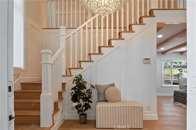 24901 Del Monte St, Laguna Hills, CA 92653 - stairs with wood finished floors, a chandelier, a decorative wall, and recessed lighting
