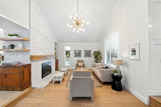 24901 Del Monte St, Laguna Hills, CA 92653 - living area featuring light wood-type flooring, a stone fireplace, a chandelier, vaulted ceiling, and ornamental molding
