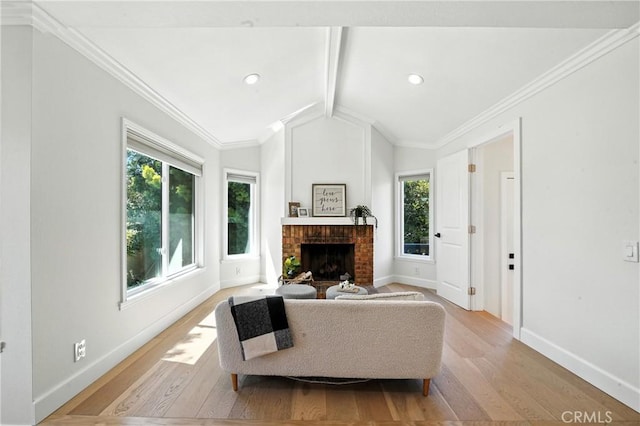 24901 Del Monte St, Laguna Hills, CA 92653 - living room featuring healthy amount of natural light, light wood-style flooring, a brick fireplace, and crown molding