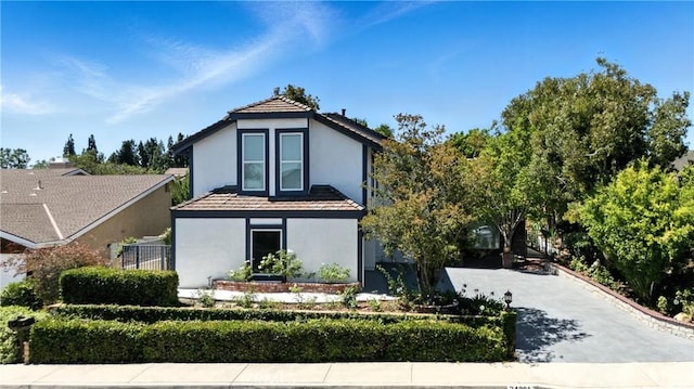 24901 Del Monte St, Laguna Hills, CA 92653 - view of front facade featuring stucco siding and driveway