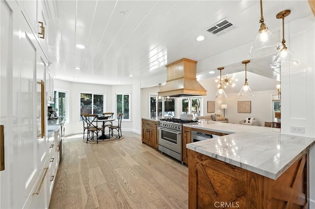 24901 Del Monte St, Laguna Hills, CA 92653 - kitchen featuring high end range, light wood finished floors, light stone countertops, recessed lighting, and pendant lighting