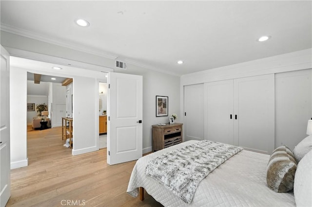 24901 Del Monte St, Laguna Hills, CA 92653 - bedroom featuring ornamental molding, recessed lighting, light wood-style flooring, and a closet