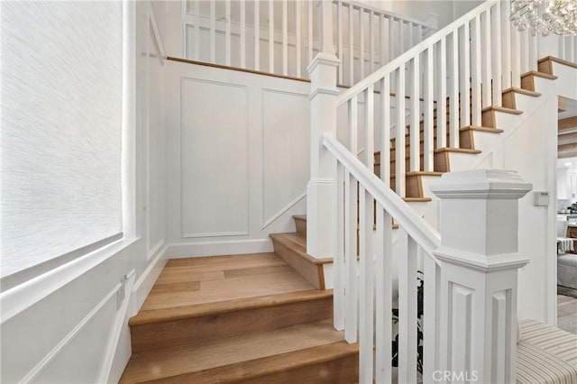 24901 Del Monte St, Laguna Hills, CA 92653 - stairway featuring wood finished floors and a decorative wall