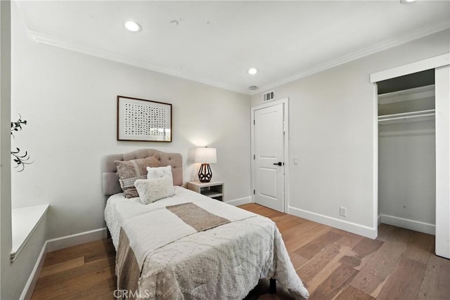 24901 Del Monte St, Laguna Hills, CA 92653 - bedroom featuring crown molding, recessed lighting, wood finished floors, and a closet
