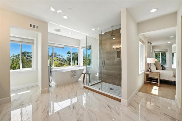 24901 Del Monte St, Laguna Hills, CA 92653 - bathroom featuring healthy amount of natural light, a shower stall, a freestanding bath, marble tiled flooring, and recessed lighting