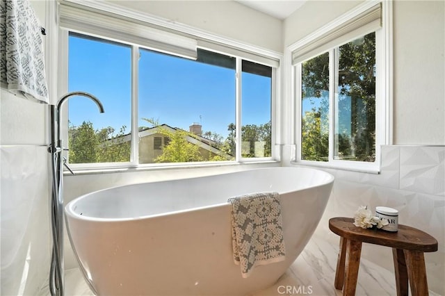 24901 Del Monte St, Laguna Hills, CA 92653 - full bath with a soaking tub, marble look tile flooring, and tile walls