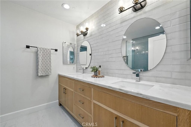 24901 Del Monte St, Laguna Hills, CA 92653 - bathroom with double vanity, marble finish flooring, and decorative backsplash