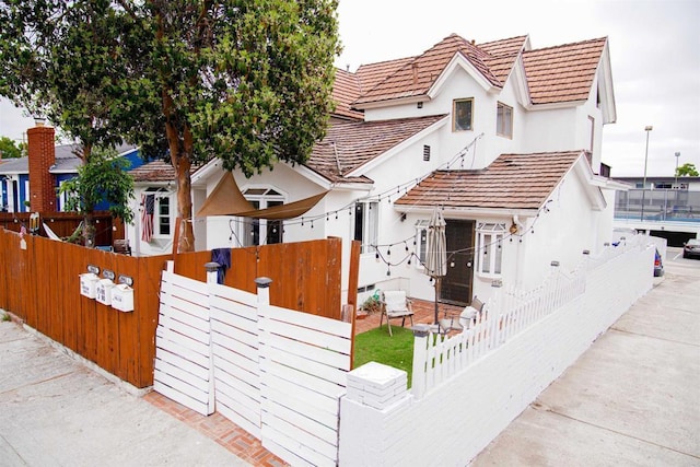 3943 Ingraham St, San Diego, CA 92109 - view of front of property featuring a gate, a fenced front yard, and stucco siding