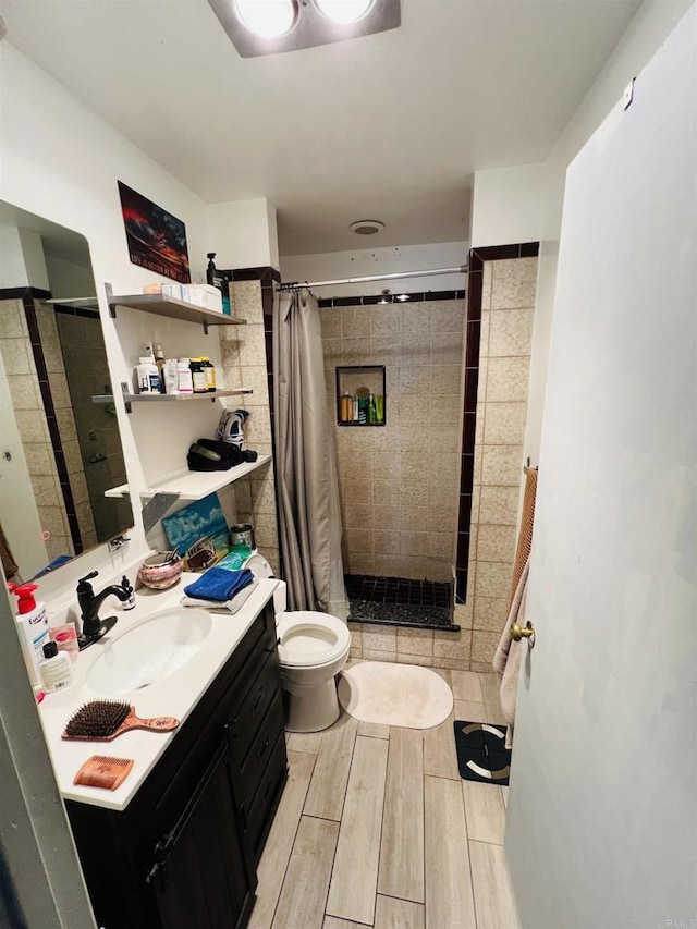 3943 Ingraham St, San Diego, CA 92109 - full bathroom with a stall shower, vanity, and wood finished floors