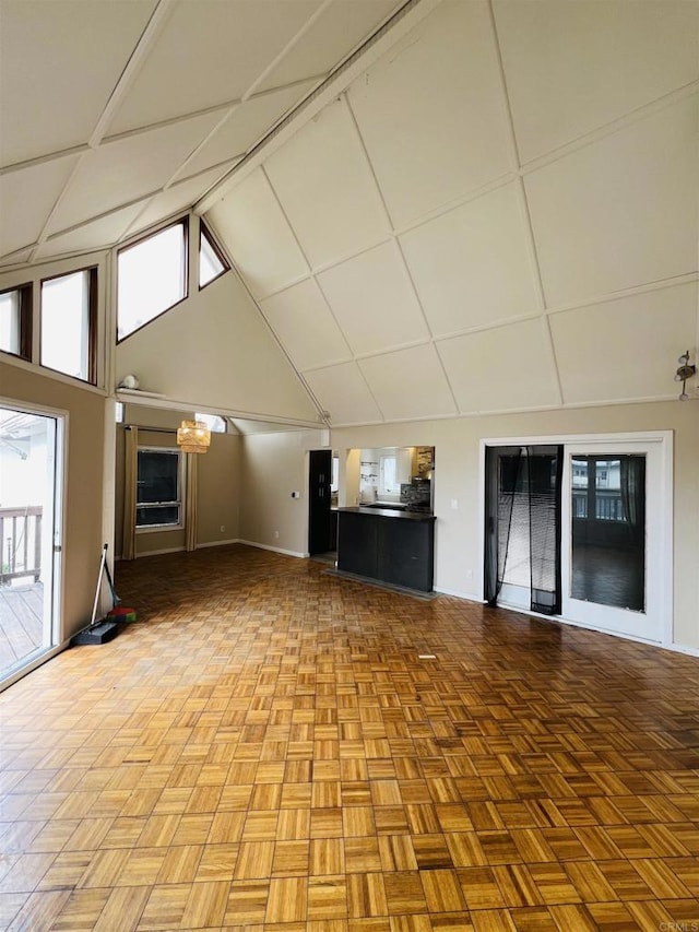 3943 Ingraham St, San Diego, CA 92109 - unfurnished living room featuring baseboards and high vaulted ceiling