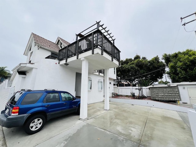 3943 Ingraham St, San Diego, CA 92109 - view of side of home with stucco siding and a balcony