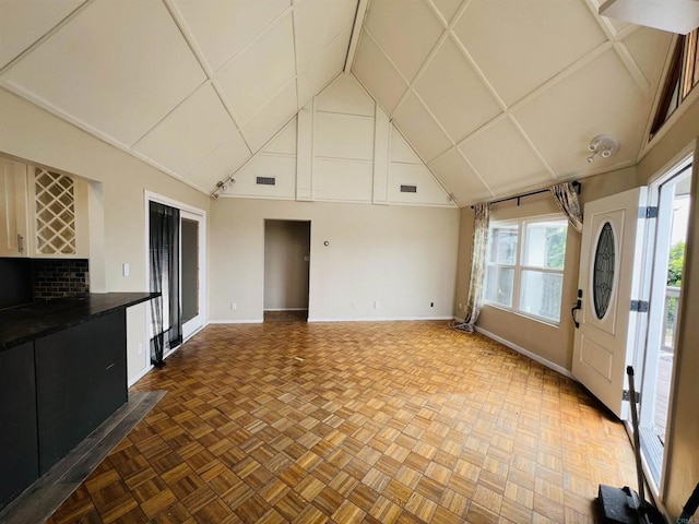 3943 Ingraham St, San Diego, CA 92109 - unfurnished living room with baseboards and high vaulted ceiling