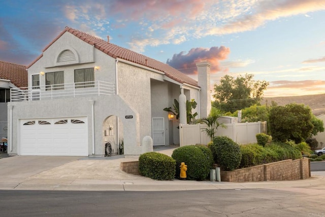 10500 Flora Azalea Ct, Santee, CA 92071 - mediterranean / spanish home with a tile roof, stucco siding, concrete driveway, an attached garage, and a chimney