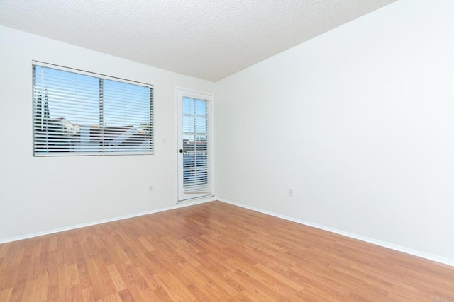 10500 Flora Azalea Ct, Santee, CA 92071 - unfurnished room featuring light wood finished floors and a textured ceiling