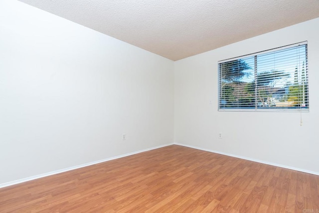 10500 Flora Azalea Ct, Santee, CA 92071 - empty room featuring light wood-style flooring and a textured ceiling