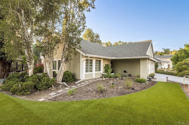 1772 Treseder Cir, El Cajon, CA 92019 - view of property exterior featuring a yard, driveway, an attached garage, and a shingled roof