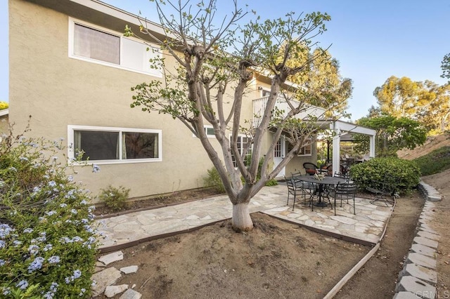 1772 Treseder Cir, El Cajon, CA 92019 - back of house featuring stucco siding and a patio area