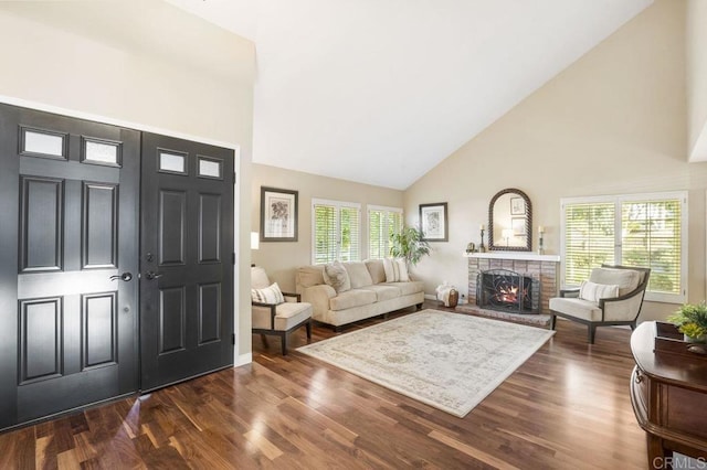 1772 Treseder Cir, El Cajon, CA 92019 - entryway with high vaulted ceiling, a lit fireplace, and dark wood-style flooring