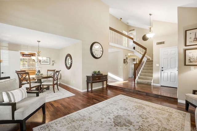 1772 Treseder Cir, El Cajon, CA 92019 - living area featuring wood finished floors, stairs, a chandelier, and a towering ceiling