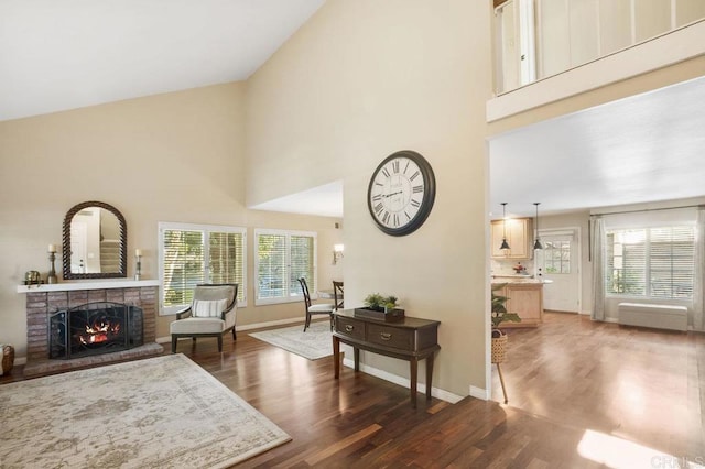 1772 Treseder Cir, El Cajon, CA 92019 - living area featuring high vaulted ceiling, wood finished floors, and a brick fireplace