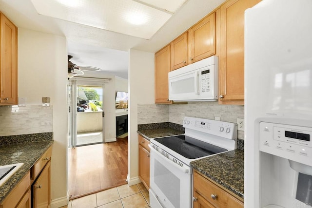 830 Broadway Unit 18, El Cajon, CA 92021 - kitchen with white appliances, tasteful backsplash, light tile patterned flooring, a ceiling fan, and dark stone counters