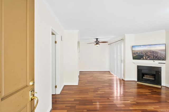 830 Broadway Unit 18, El Cajon, CA 92021 - unfurnished living room featuring wood finished floors, a ceiling fan, a fireplace with flush hearth, and crown molding