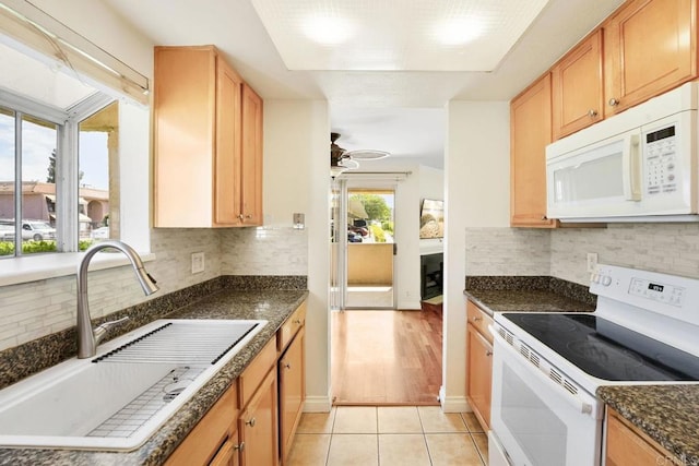 830 Broadway Unit 18, El Cajon, CA 92021 - kitchen featuring white appliances, light tile patterned floors, backsplash, and ceiling fan