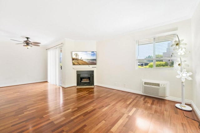 830 Broadway Unit 18, El Cajon, CA 92021 - unfurnished living room with a wall unit AC, wood finished floors, a fireplace with flush hearth, crown molding, and a ceiling fan