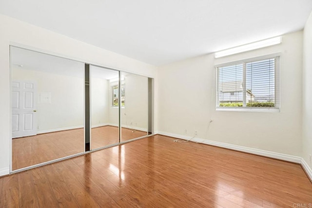 830 Broadway Unit 18, El Cajon, CA 92021 - unfurnished bedroom featuring wood finished floors and a closet