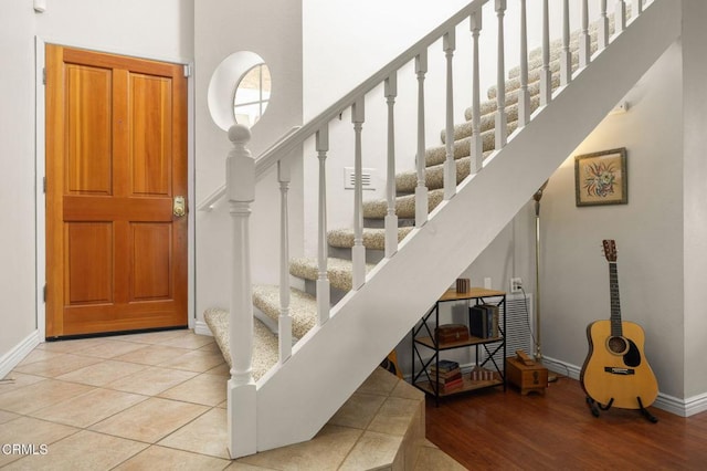 28802 Raintree Ln, Saugus, CA 91390 - entryway with stairs, wood finished floors, and a high ceiling