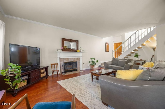 28802 Raintree Ln, Saugus, CA 91390 - living room featuring ornamental molding, wood finished floors, stairs, and a tile fireplace