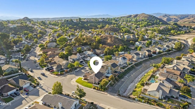 28802 Raintree Ln, Saugus, CA 91390 - aerial overview of property's location featuring nearby suburban area and a mountainous background