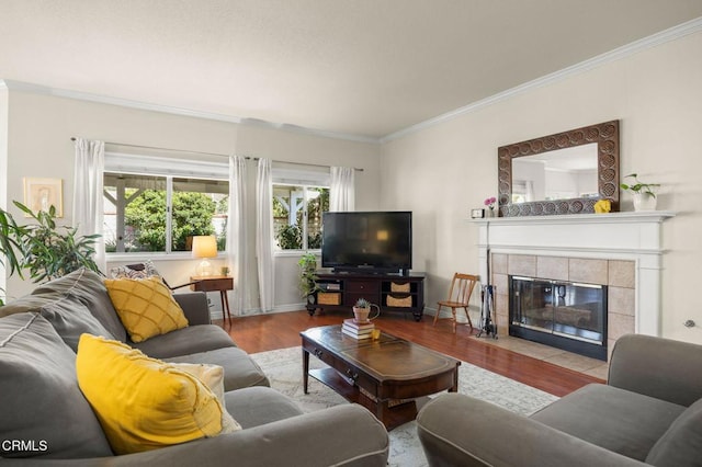28802 Raintree Ln, Saugus, CA 91390 - living room with wood finished floors, crown molding, and a tile fireplace