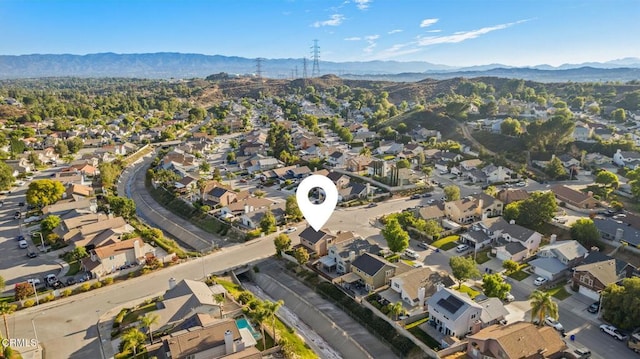 28802 Raintree Ln, Saugus, CA 91390 - aerial view of property and surrounding area featuring a mountainous background and nearby suburban area